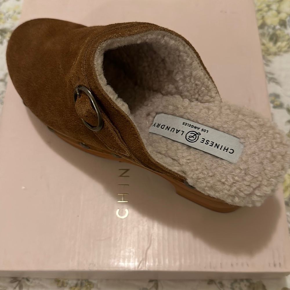 Brown platform sued clogs
